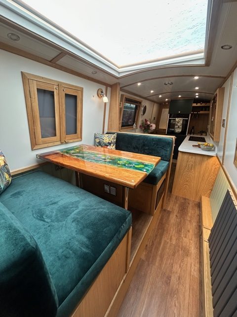 Bespoke Bluewater narrowboat dining and galley area